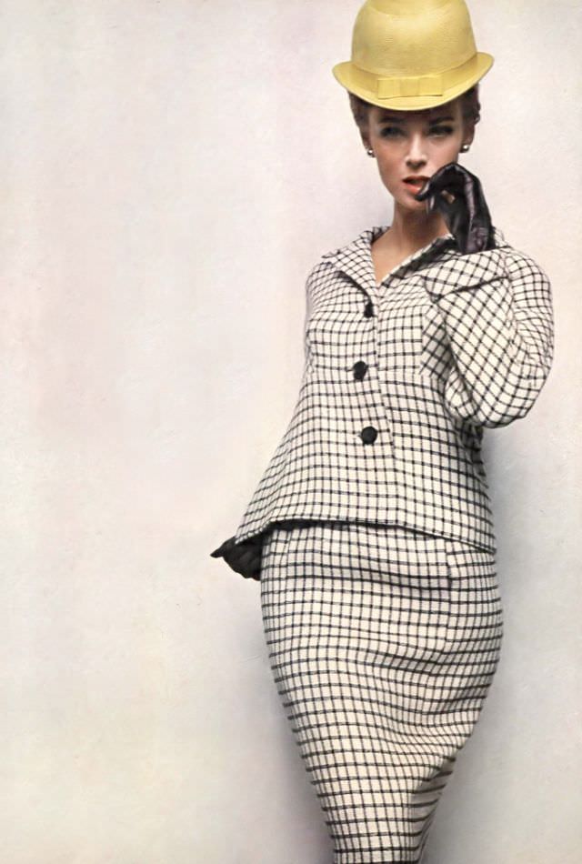 Anne de Zogheb in wool tattersall check dress and jacket with long cuffed sleeves worn with yellow straw bowler, both by Gustave Tassell, Vogue, January 15, 1963