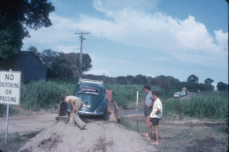 Betty driving Gi-Gi off truck after crossing the Herbert, Feb 1963