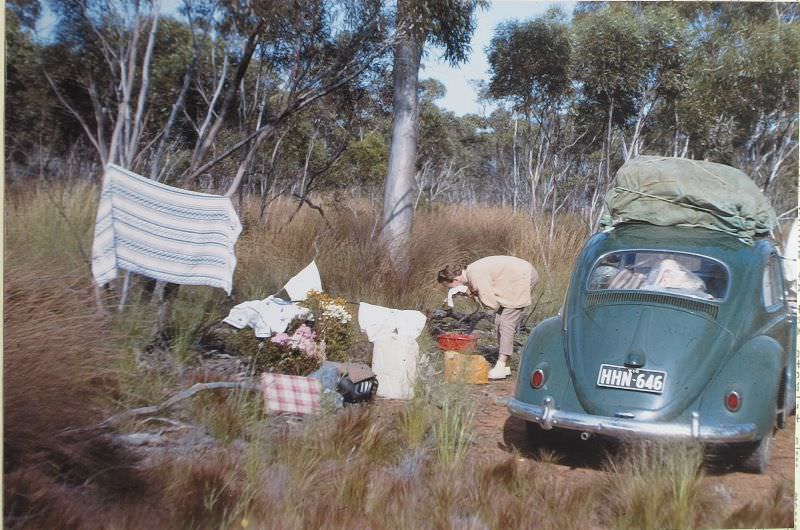 Betty and a morning wash-after cleaning the oil filter, Western Australia, May 6, 1963