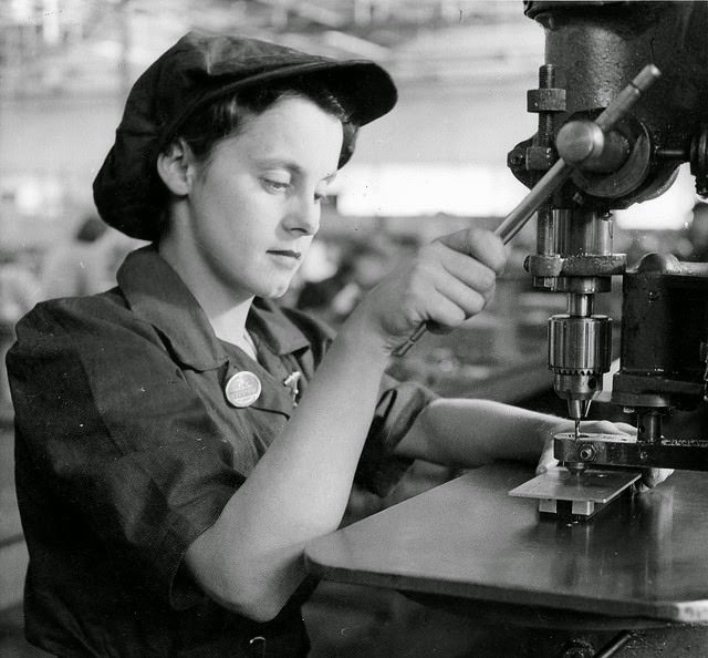 A young woman drilling aeroplane parts in a munitions factory in South Australia.