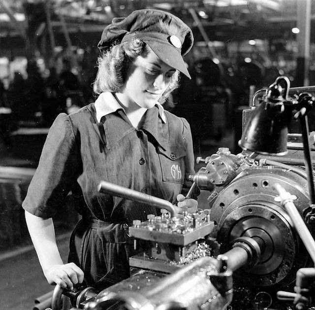 A young woman cutting driving bands for anti-aircraft shells in a munitions factory in South Australia.