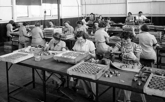 Women working in a munitions factory assembling Gaine anti-aircraft shell fuse components.