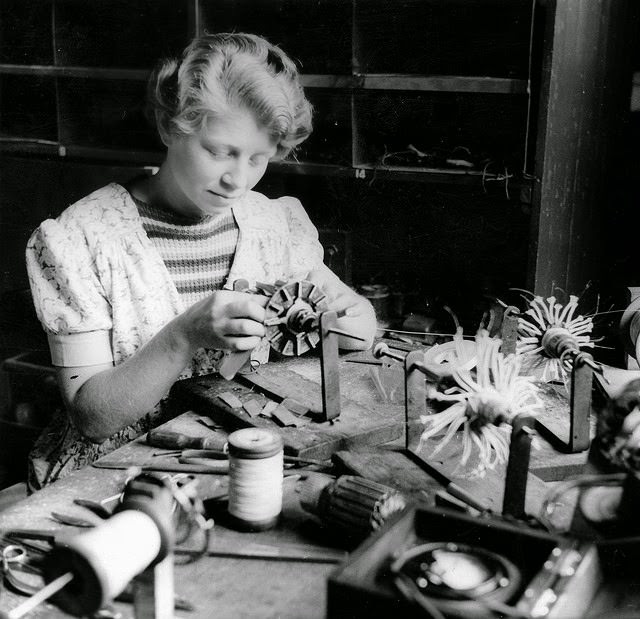 A young woman armature winding in a munitions factory in South Australia.