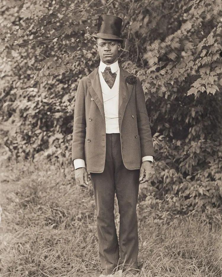 Isaac (Ike) Perkins Wearing a Top Hat. Ike Perkins was a member of the Improved Benevolent Order of Elks of the World and posed for Bullard informal wear, worn by Elks for special ceremonies.