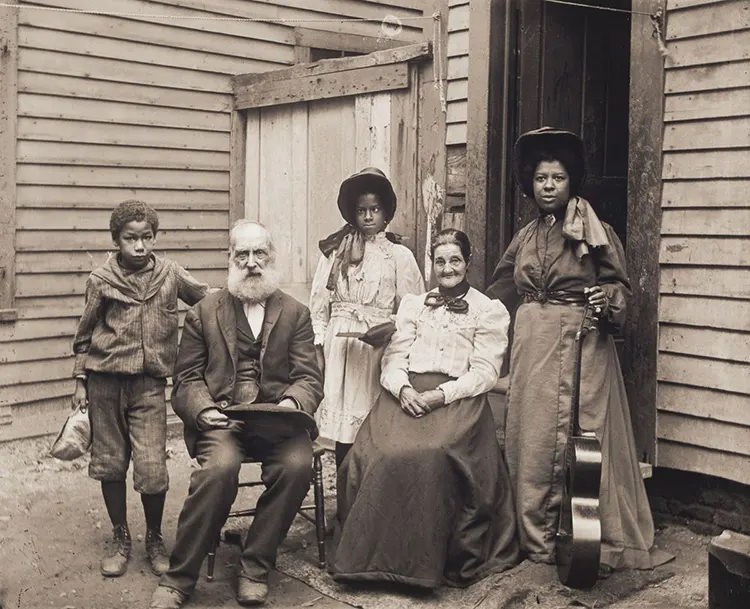 Mixed-Race Group, Including a Woman With a Guitar. This group may have been entertainers at an Old Home Days celebration, a popular event at the turn of the century held to commemorate the area’s rural past, 1906.