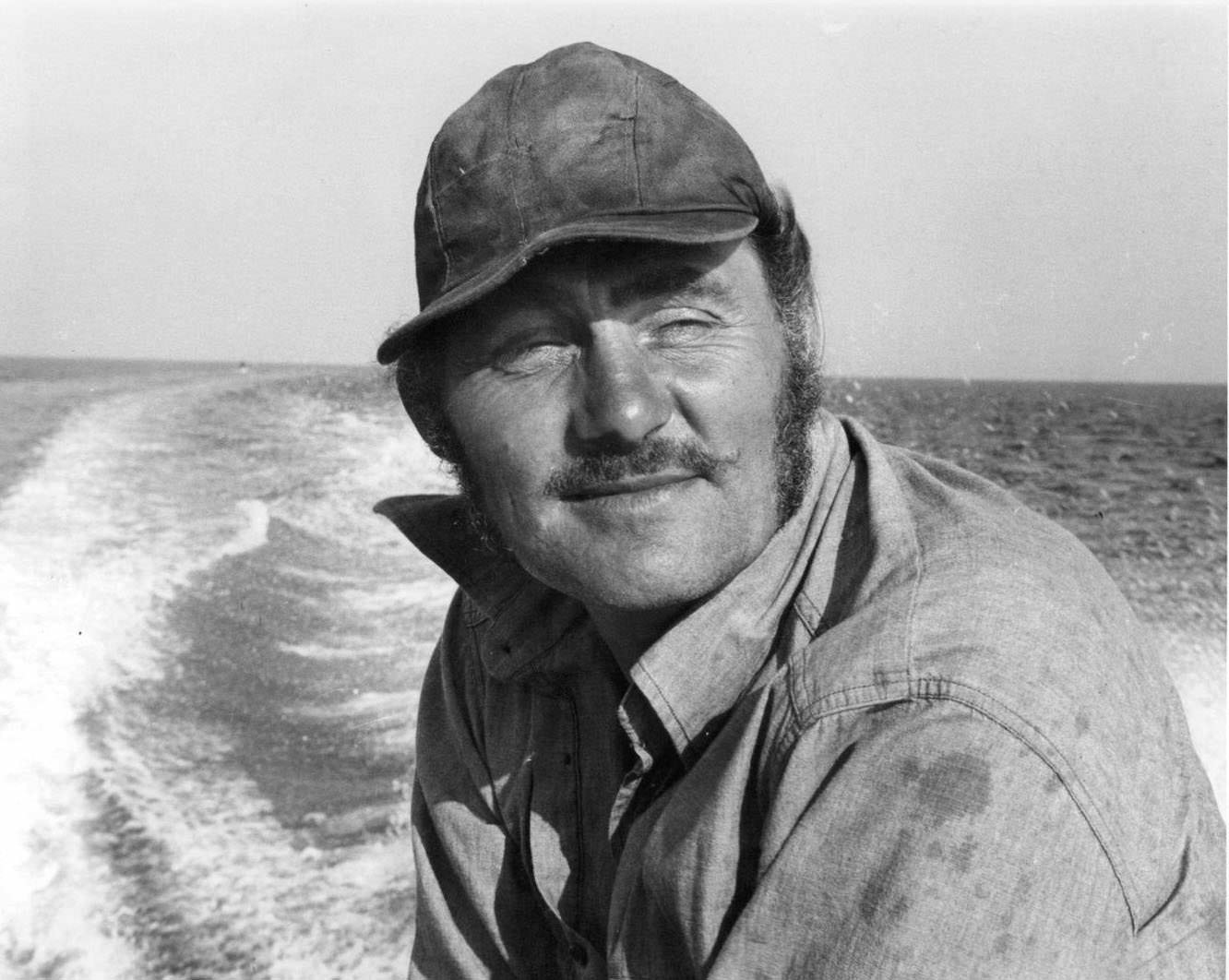 Robert Shaw stands around netting in a scene from the film 'Jaws', 1975.