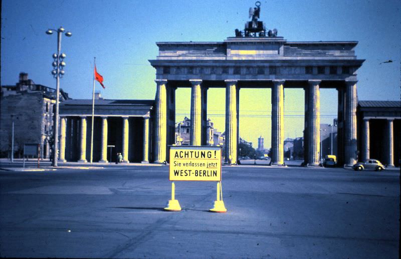 Brandenburger Tor. East Berlin began immediately behind the notice, not at the Tor itself as sometimes thought. This can be evidenced by the red flag this side of the Tor, September 11, 1959