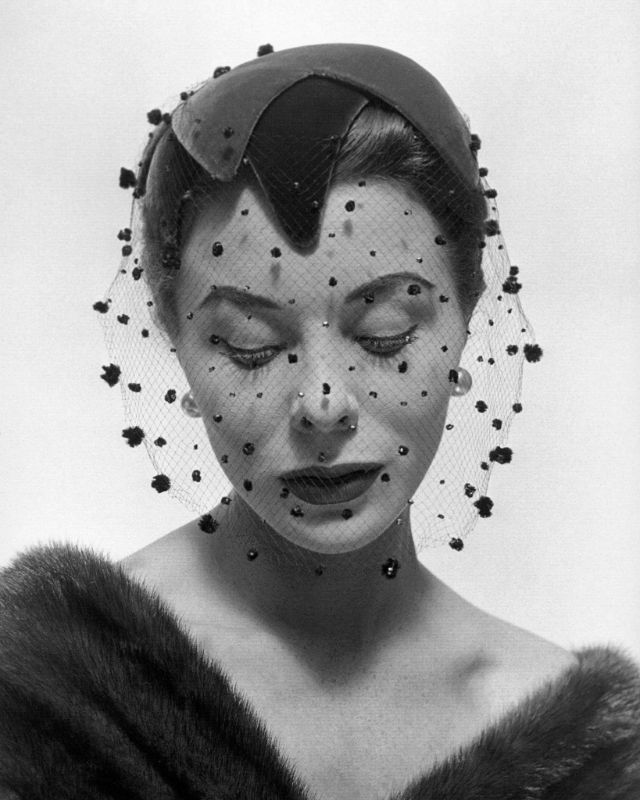 Bettina wearing velvet veiled hat by Paulette, Arachnée, November 1953