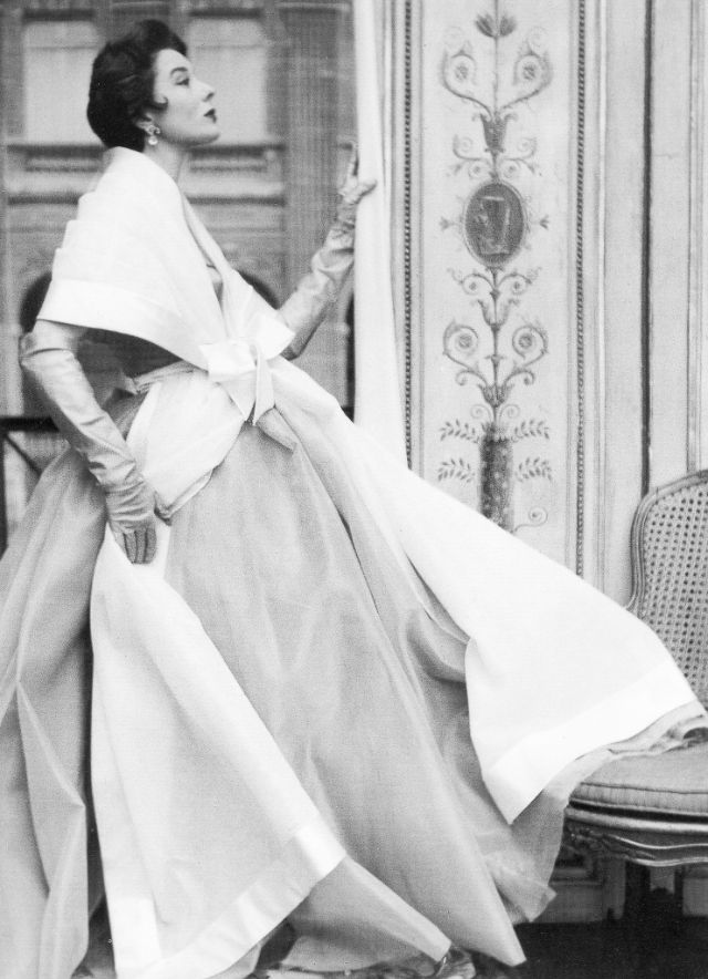 Bettina in silk gown and stole of white organza framed by wide satin ribbon from Givenchy's first collection, 1952