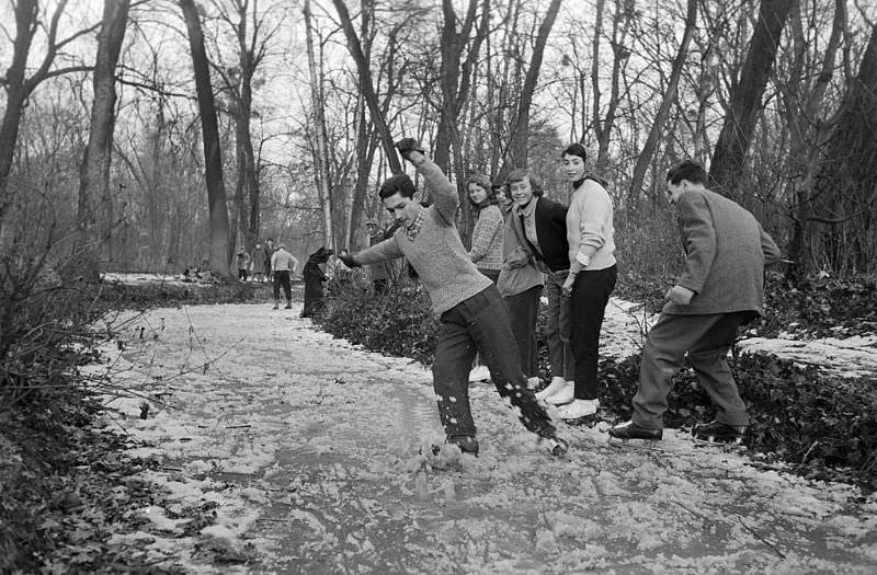 A young man showing his friend his skating skill.