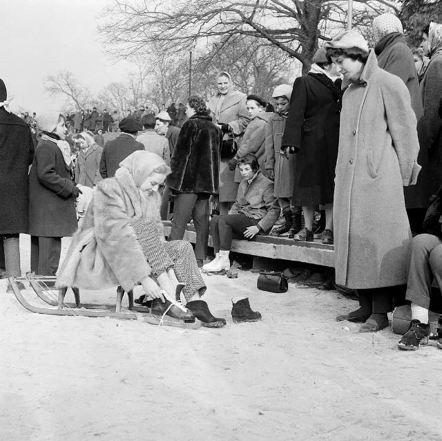 Tessa Beaumont, dancer from Les Ballets Roland Petit, putting on her skates.
