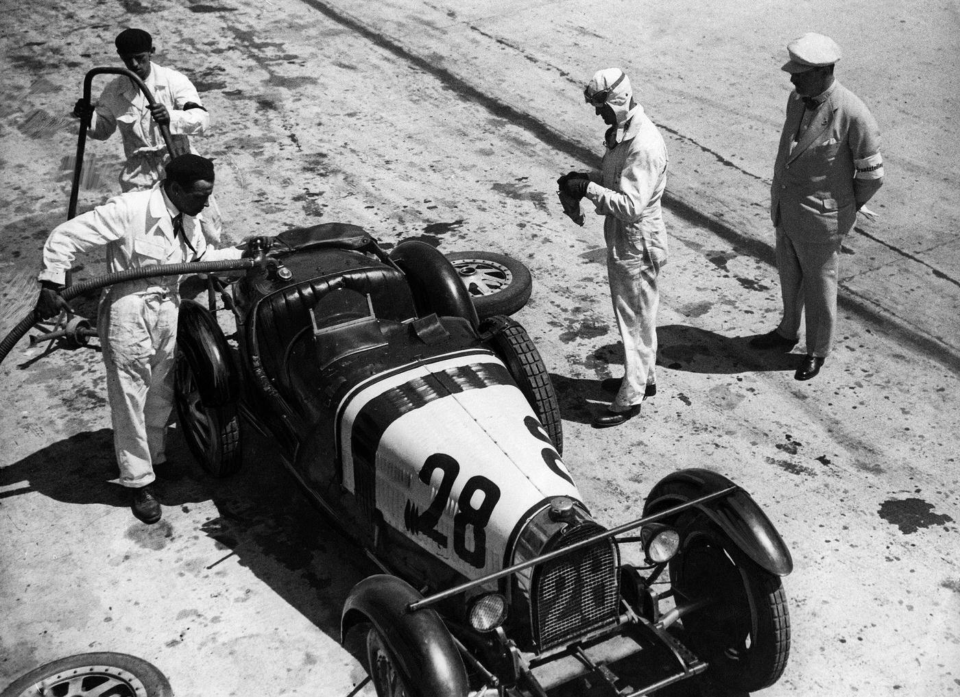 Racing Driver refuelling Bugatti, 1930