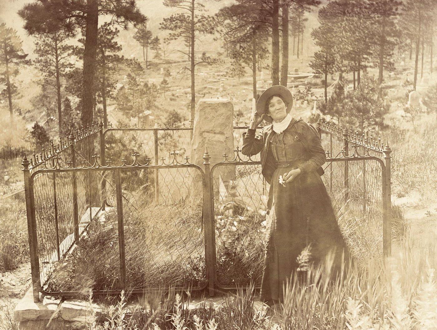 Calamity Jane at the Grave of Wild Bill Hickok in Deadwood, South Dakota