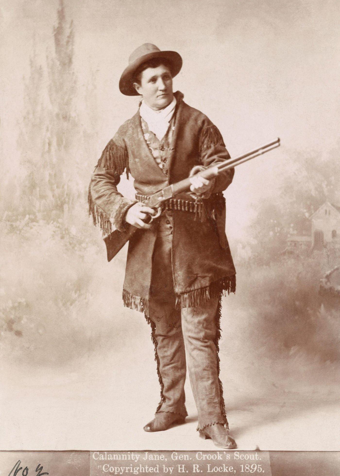 Portrait of Calamity Jane holding a rifle, 1895.