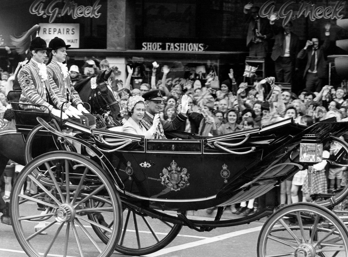 Queen Elizabeth II and Prince Philip visiting Wales during the silver jubilee tour, pictured passing through, Cardiff, 24th June 1977.