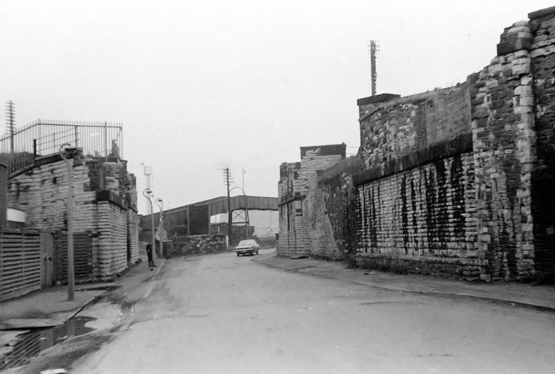 Bridge buttresses that once supported the bridges taking the lines down to the eastern side of the Bute East dock. All gone, Cardiff, March 1974