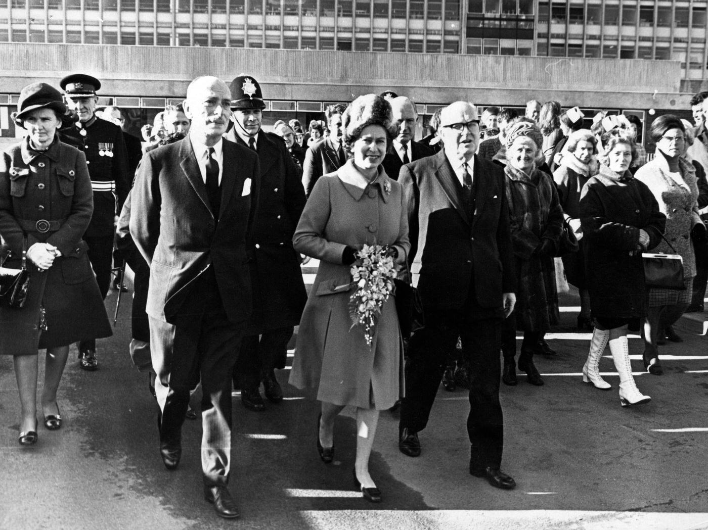 Queen Elizabeth II walks to Cardigan House from the hospital.