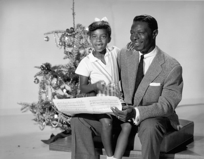 Nat King Cole sings carols with daughter Natalie Cole, 1970.
