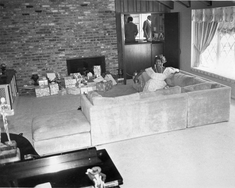 Aretha Franklin with her Christmas presents at her Detroit home, 1980.