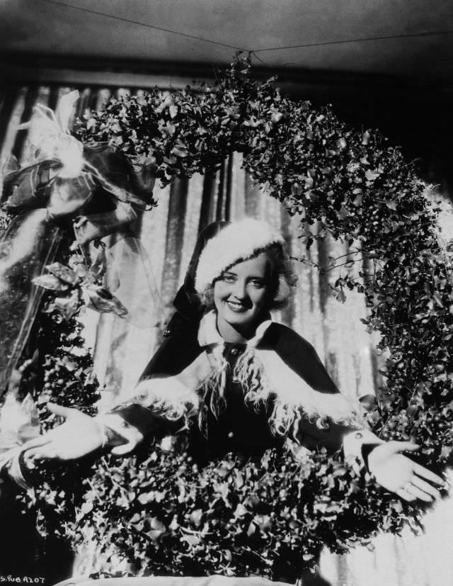 Bette Davis dressed up as Santa Claus, 1930.