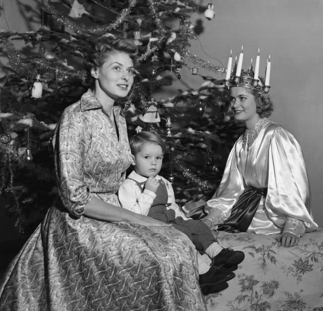 Ingrid Bergman celebrates Swedish traditions with her two-year-old son, Renato Roberto Rossellini, 1952.