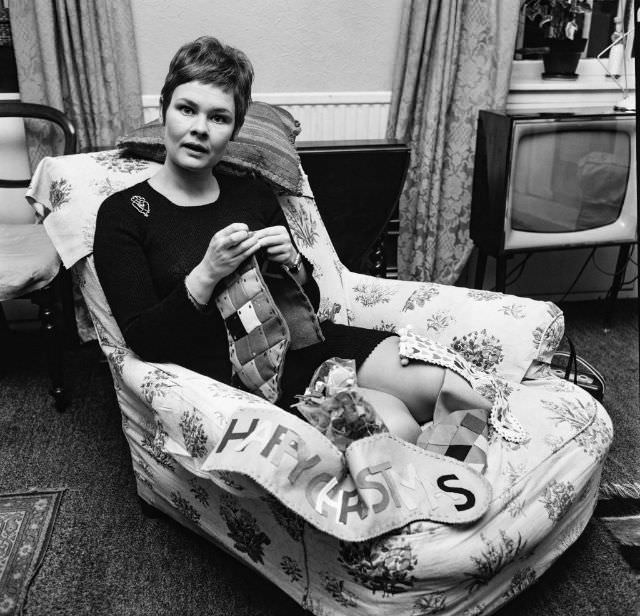 Judi Dench sews Christmas stockings for her nephews, December 1967.