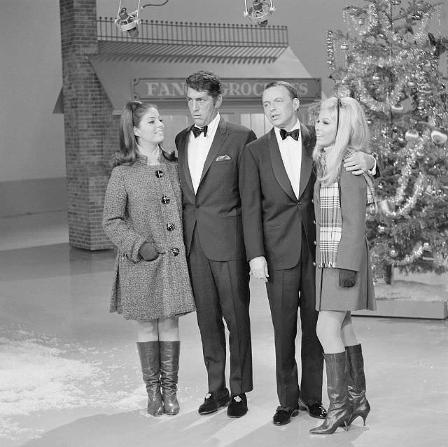 Dean Martin and Frank Sinatra joined by daughters Gail Martin and Nancy Sinatra for a Christmas segment on The Dean Martin Show, 1967.