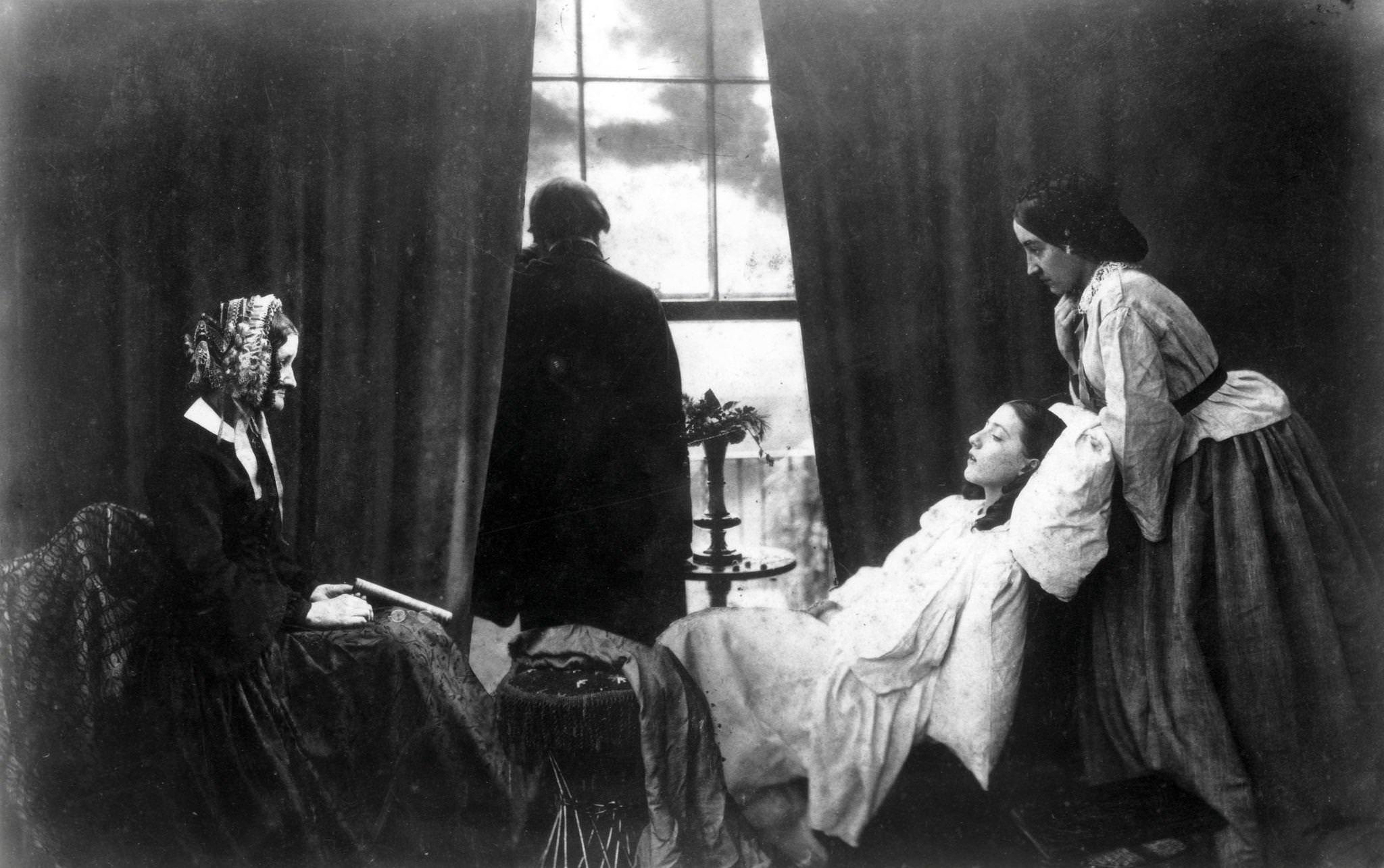 A young girl on her deathbed surrounded by her family, 1860