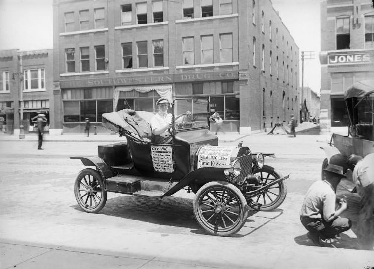 Nicely dressed young man driving a Ford Roadster around promoting the newly invented Everful Water System, 1915