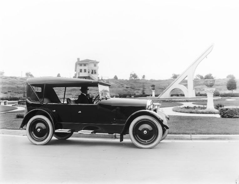 A Haynes Motor Car Co. automobile pictured in front of the "World's Largest Sundial". This unusual landmark is still located in the prestigious Ingleside Terraces neighborhood in San Francisco, California, 1920s