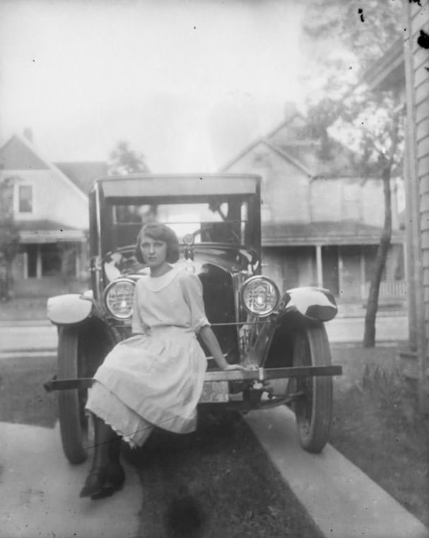 Girl on car, 1920s