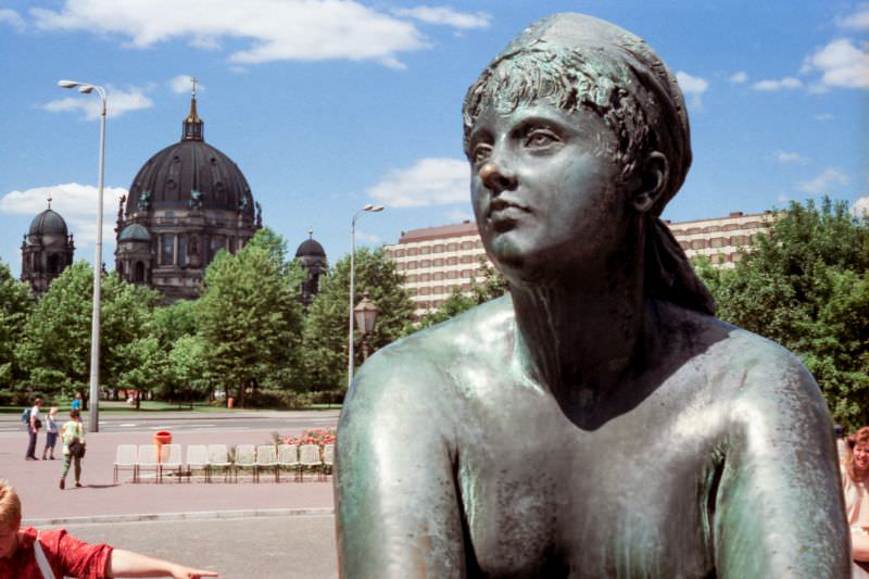 Part of the Neptunbrunnen fountain, with the Berliner Dom behind, East Berlin, Germany, 1989