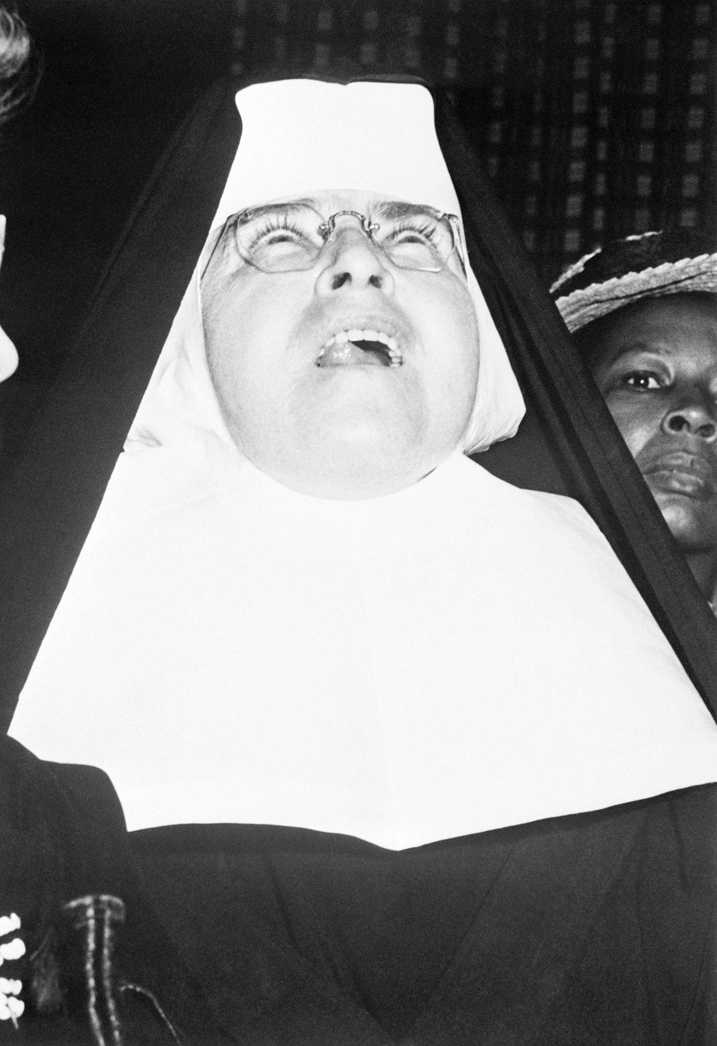 Nun Looking at Plane Crash on Empire State Building