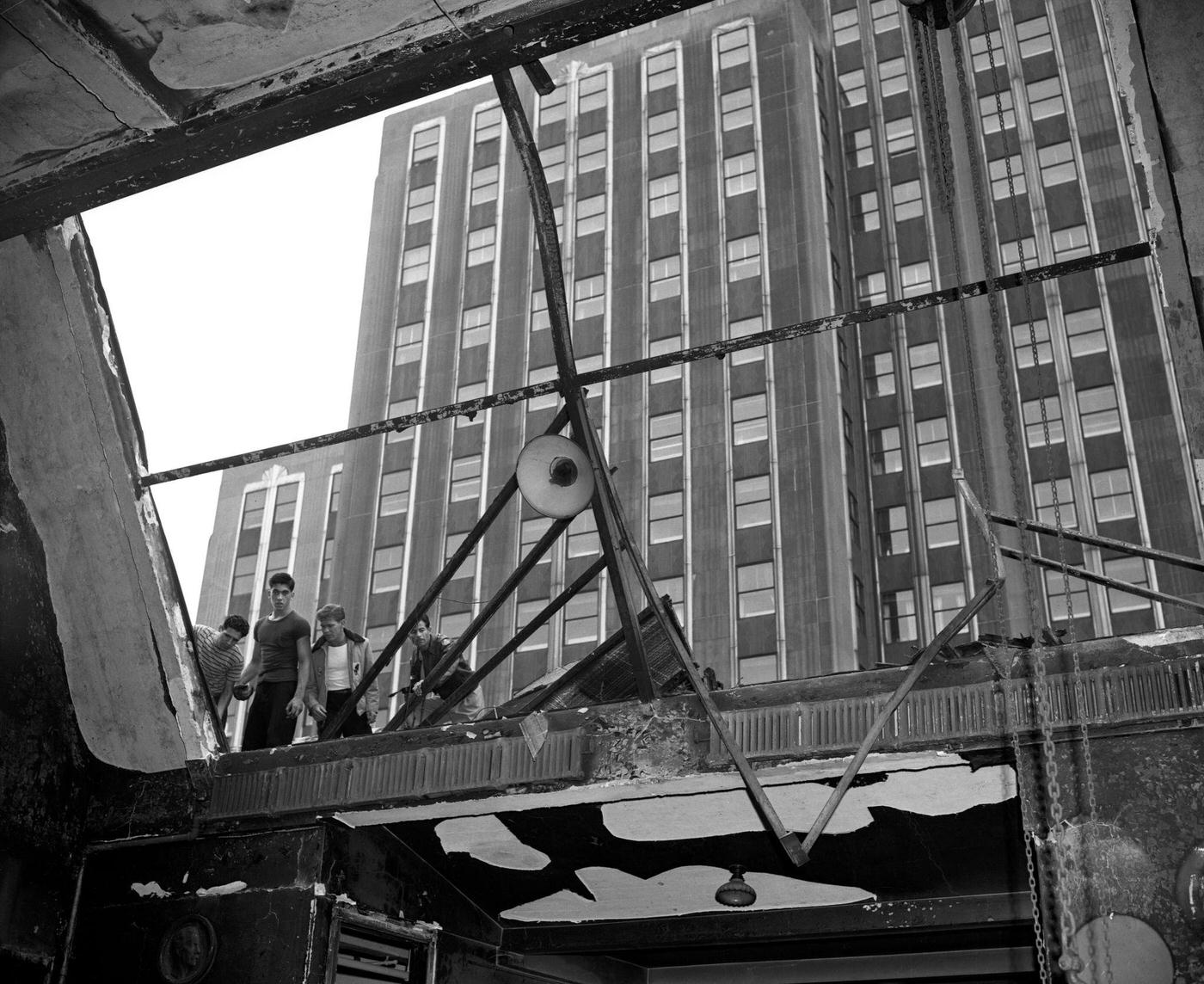 Crew at Airplane Crash Site on City Skyscraper