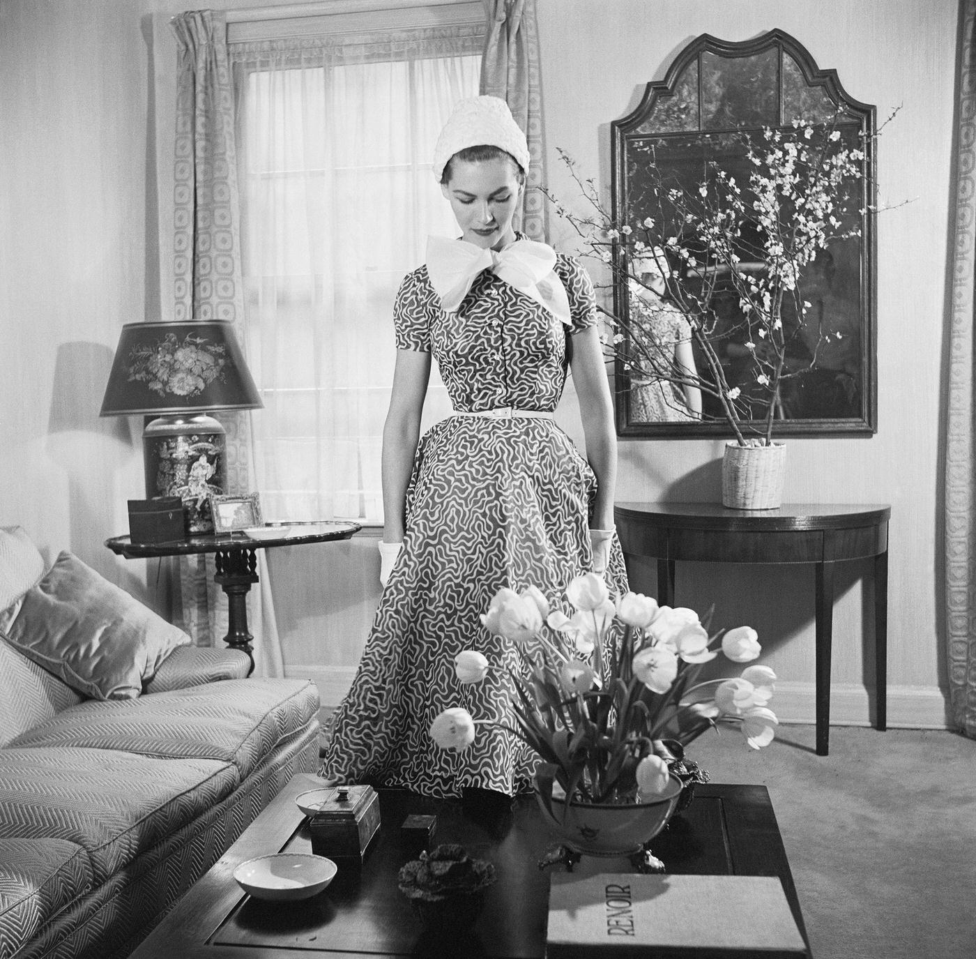 Georgia Hamilton models a slate gray and white day dress by Carolyn Modes.