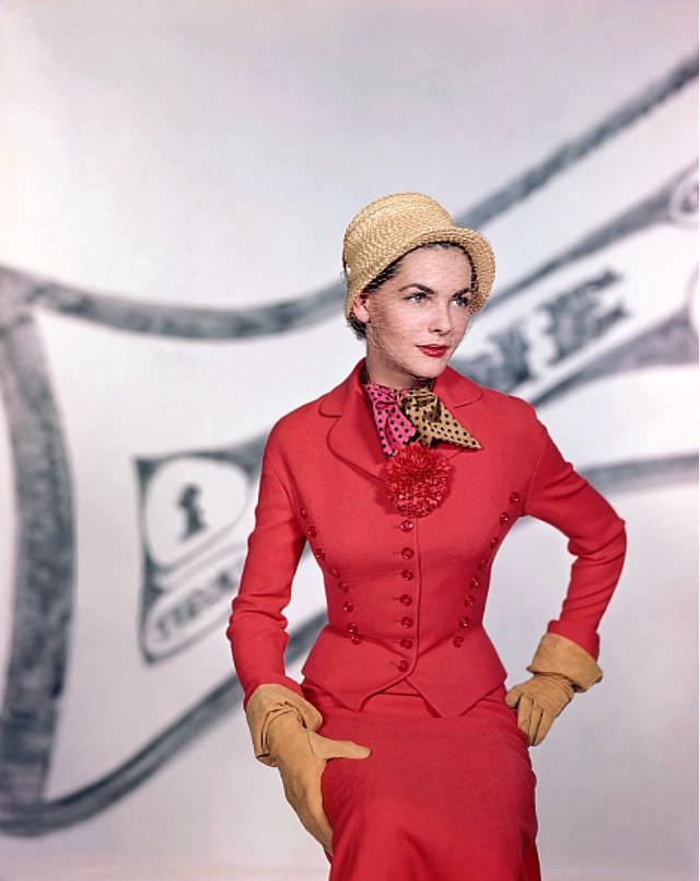 Georgia Hamilton wears a red wool suit by Harry Frechtel, 1949