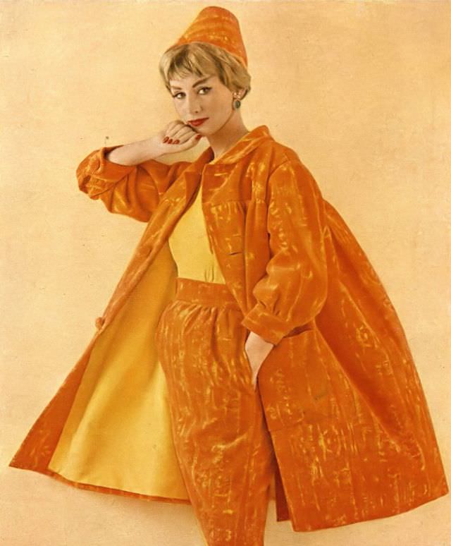 Ruth Neumann Derujinsky in dinner suit of orange and yellow velveteen, matching cone hat by Emme, photo by Gleb Derujinsky, Harper's Bazaar, April 1959