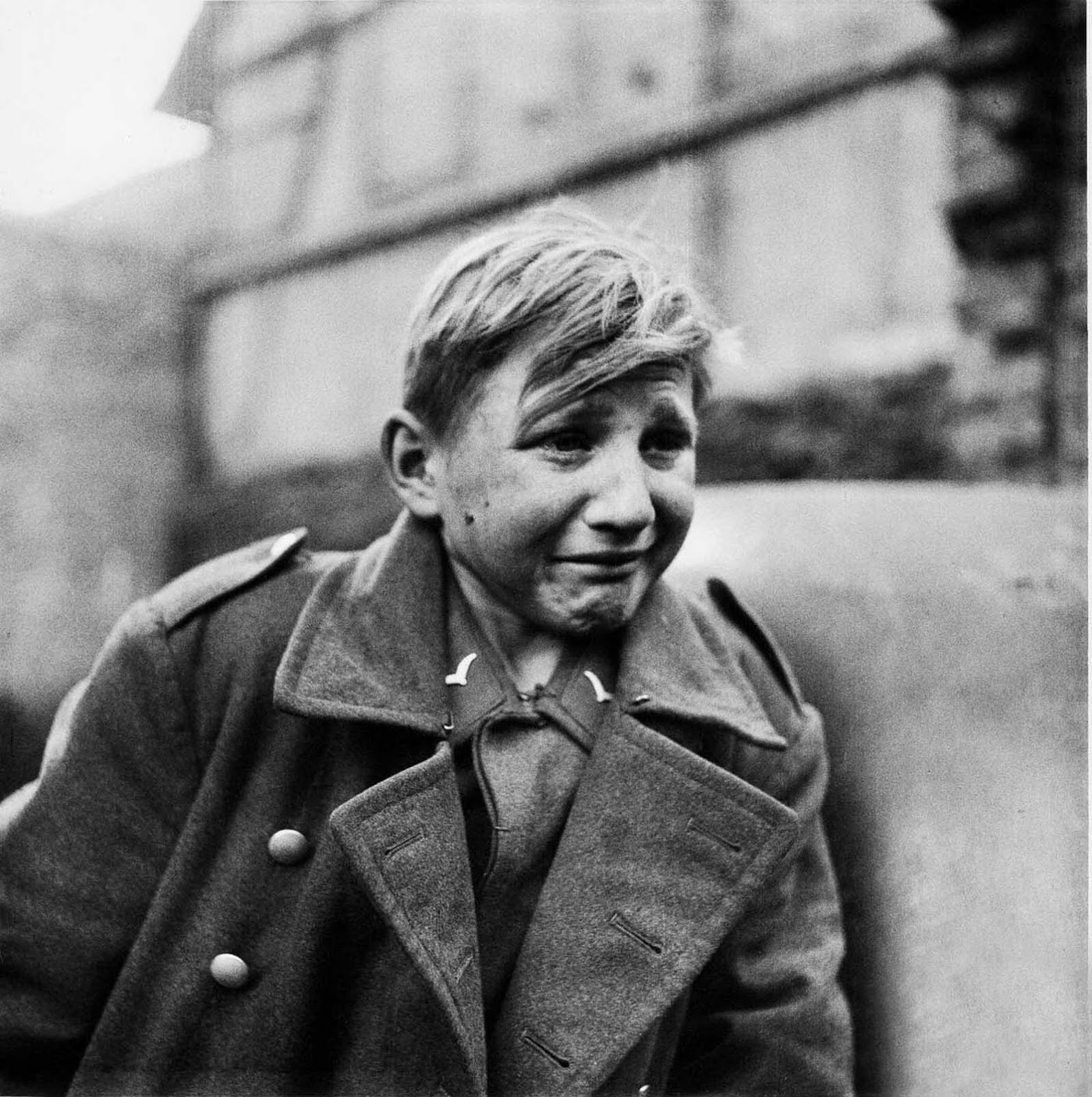 A sixteen-year-old German soldier, Hans-Georg Henke, cries being captured by the US 9th Army in Germany on April 3, 1945