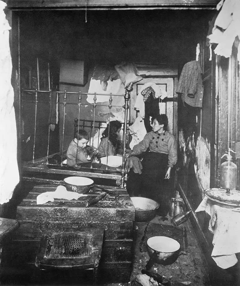 Bedroom of Italian family in a rear tenement of the New York East Side, 1910.