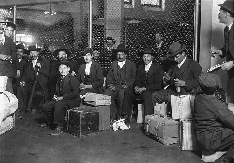 Group of Italians in the Railroad Waiting Room, Ellis Island, 1905.