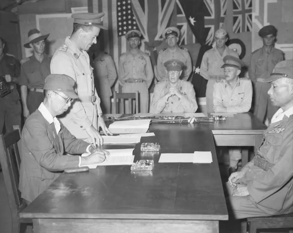 Masatane Kanda signs the instrument of surrender of Japanese forces on Bougainville Island, New Guinea.