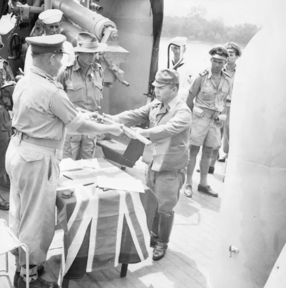 The official surrender ceremony of the Japanese to the Australian forces on board HMAS Kapunda at Kuching, Kingdom of Sarawak, on 11 September 1945.