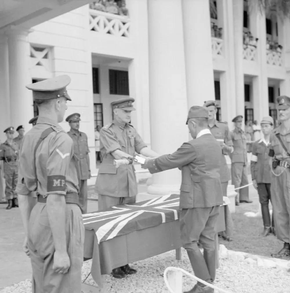 The surrender ceremony of the Japanese to the British forces with General Itagaki surrendering his sword to General Frank Messervy at Kuala Lumpur, British Malaya, on 22 February 1946.