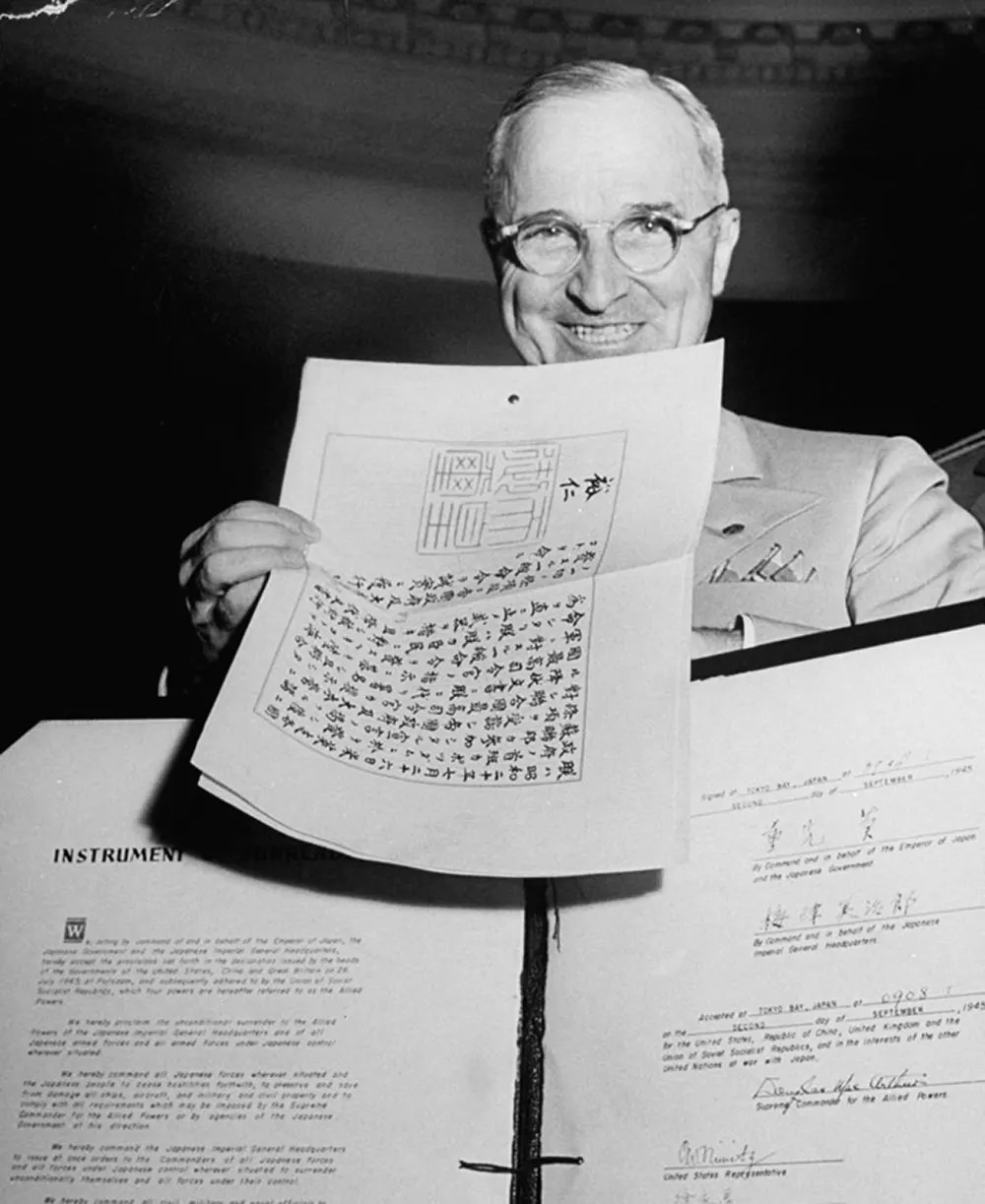 President Truman with the Japanese surrender documents.