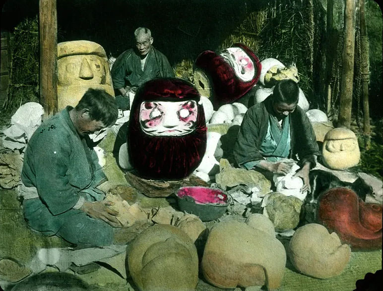 Men making clay moulds for giant masks.