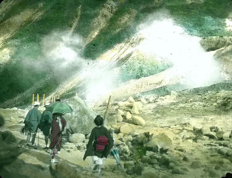 Japanese people in local attire hiking through mountains.
