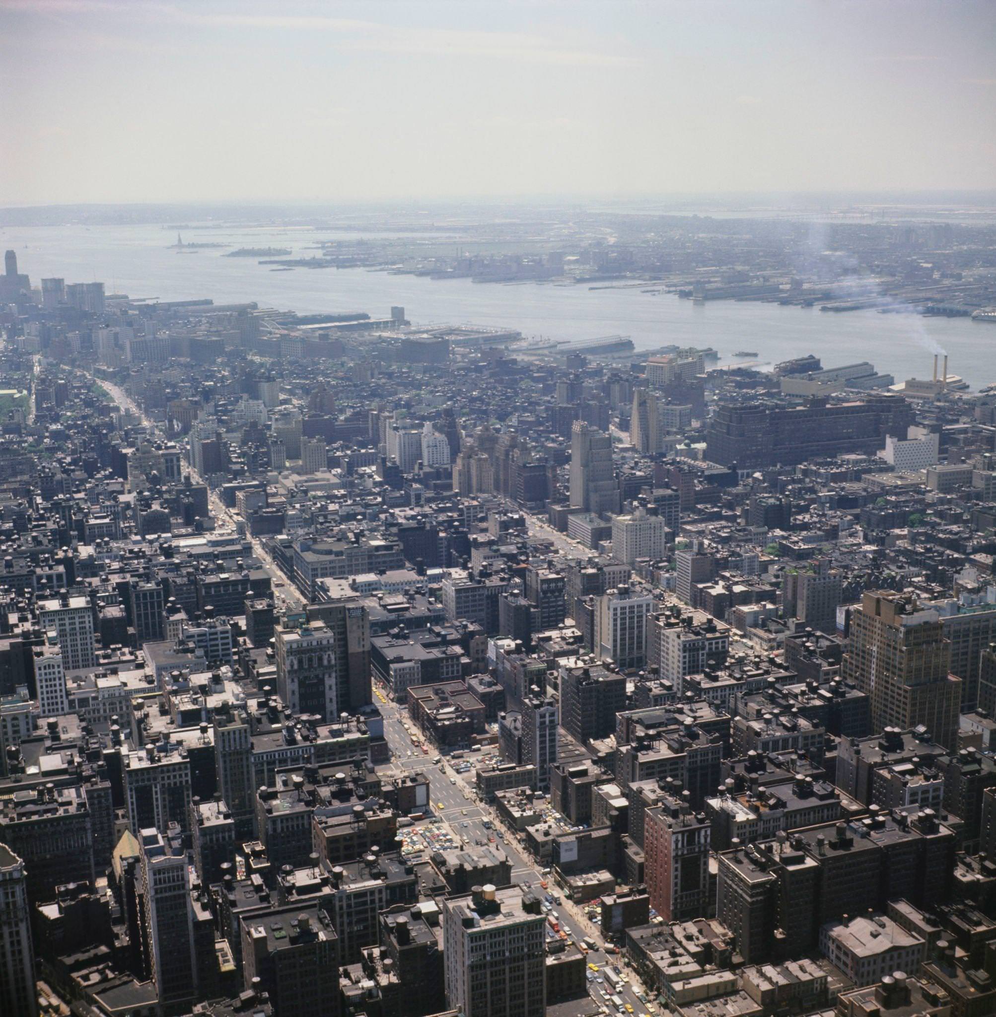 Aerial view from the top of the Empire State Building looking south-west over 7th and 8th Avenues in Manhattan to the Hudson River and Jersey City in New Jersey beyond, 1970