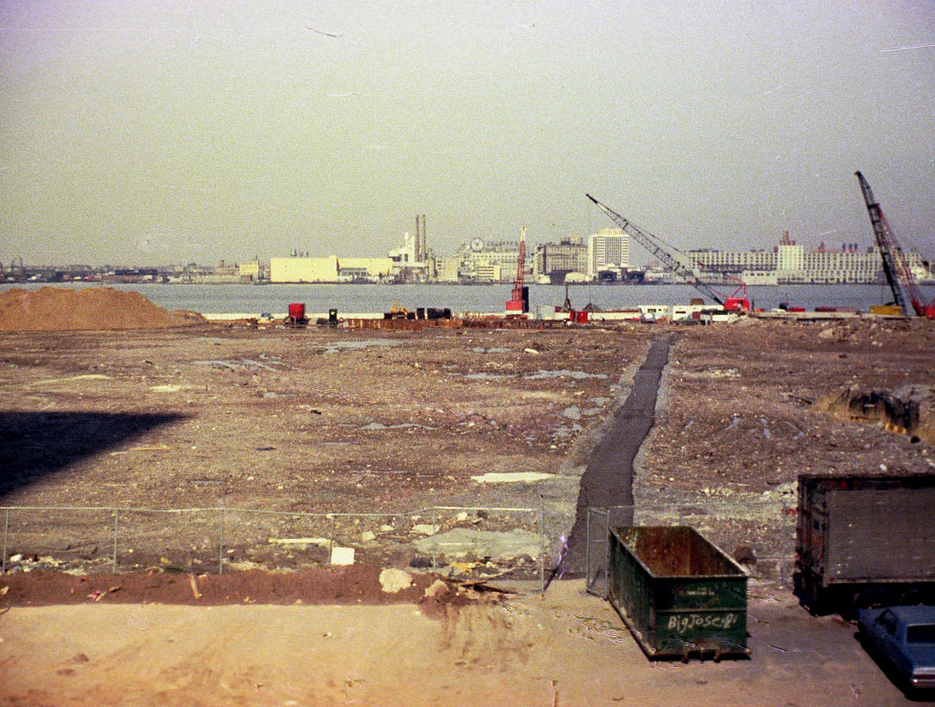 Battery Park City landfill towards Jersey City from the abandoned West Side Highway in front of the World Trade Center(its shadow on the left), May 1974