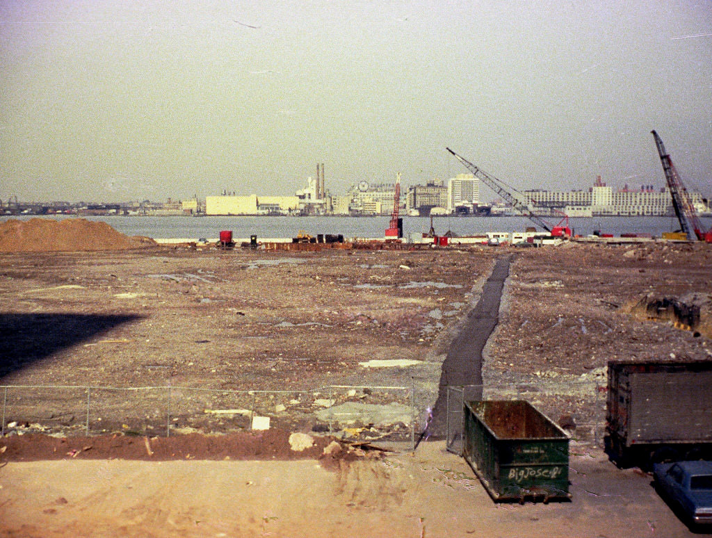 Battery Park City landfill towards Jersey City from the abandoned West Side Highway in front of the World Trade Center(its shadow on the left), May 1974