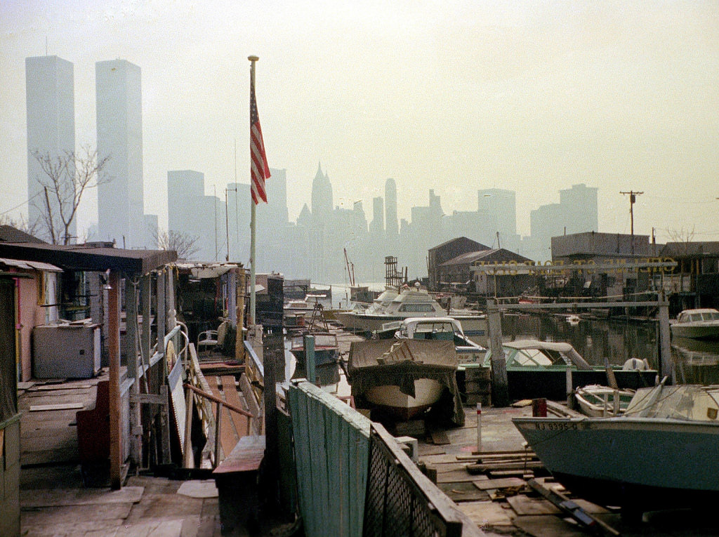 Greene Street Boat Club in Jersey City with the Lower Manhattan skyline and the World Trade Center in the distance, 1975